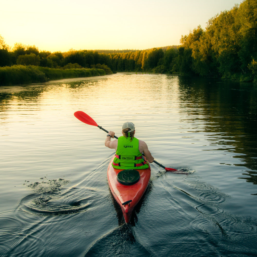 A man kayaking in the beautiful scenery of Ounasjoki River