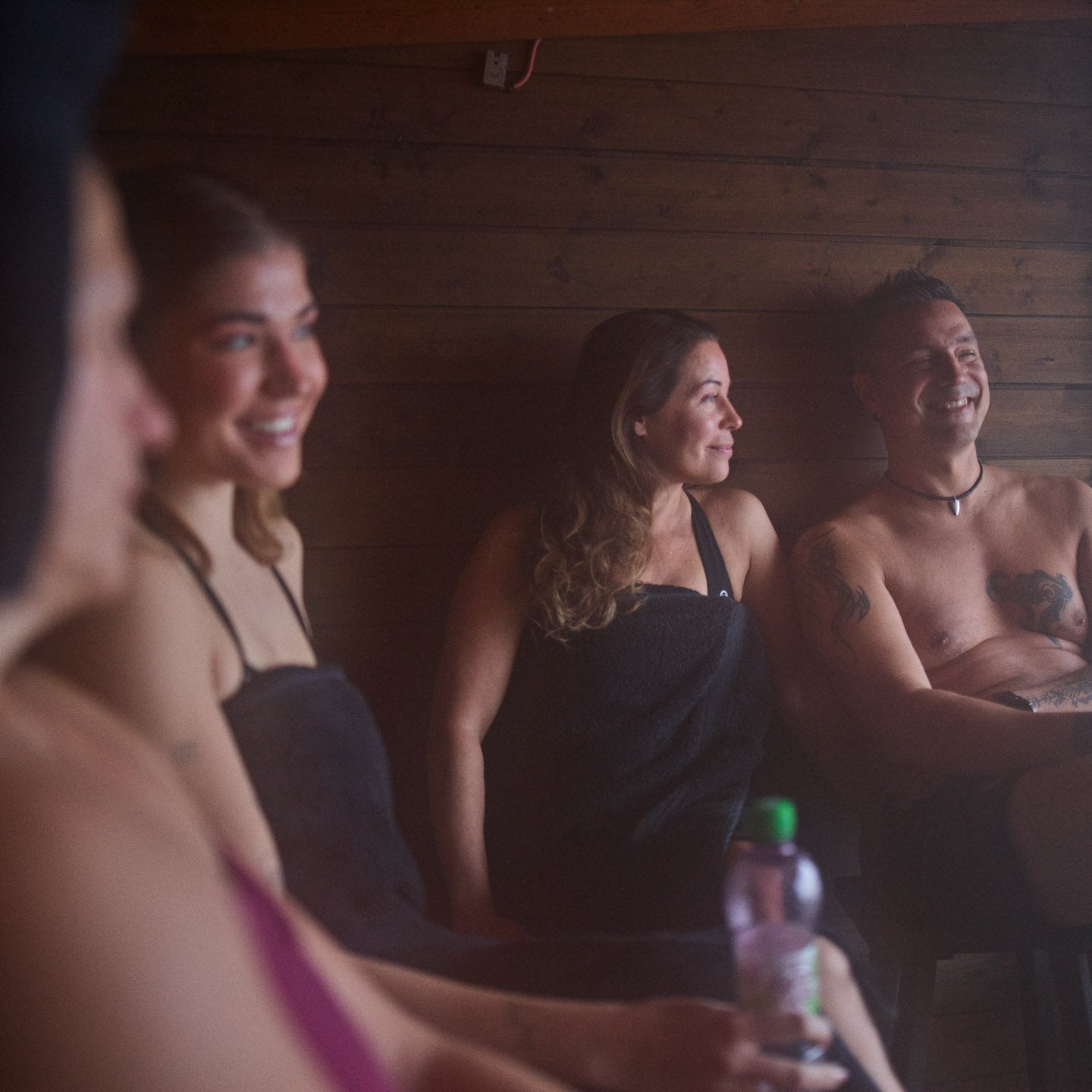 Four people enjoying sauna